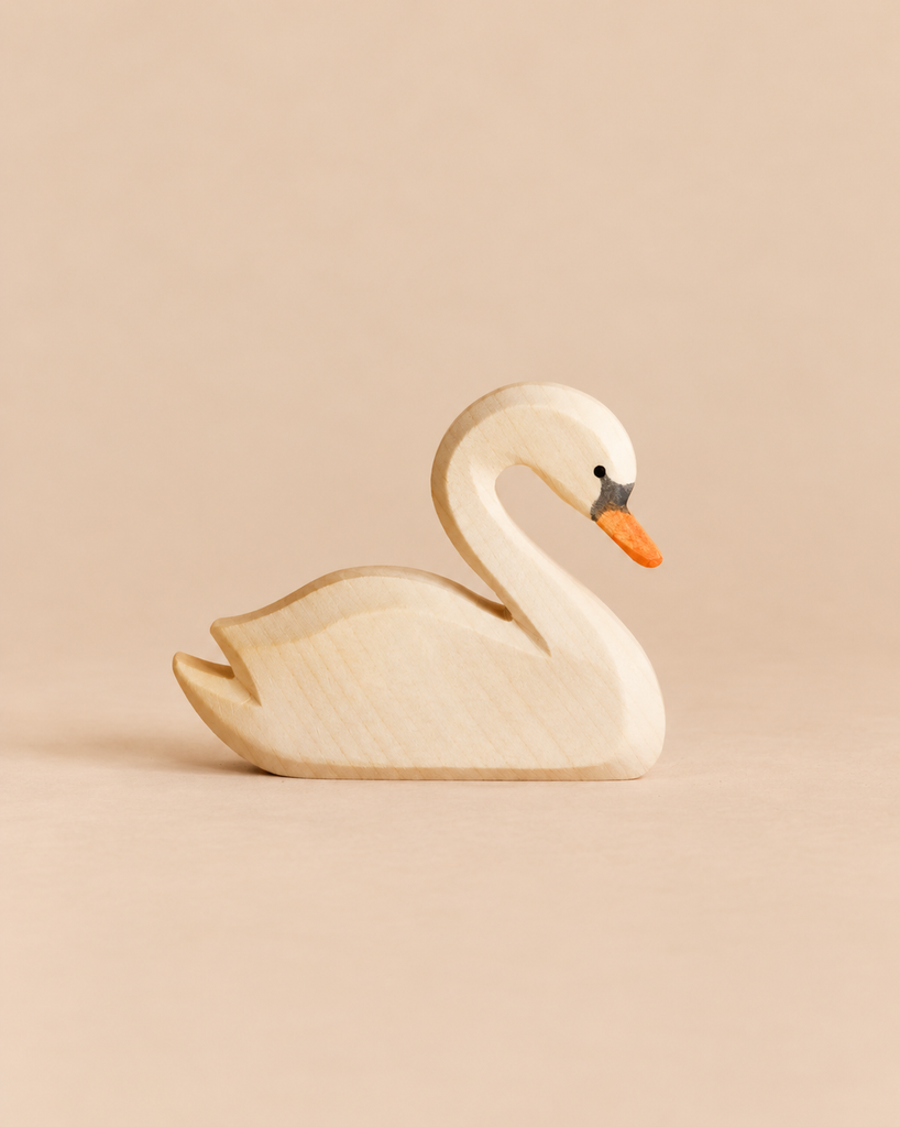 Ostheimer Swan handcrafted wooden toy with a painted orange beak and black eye detail.