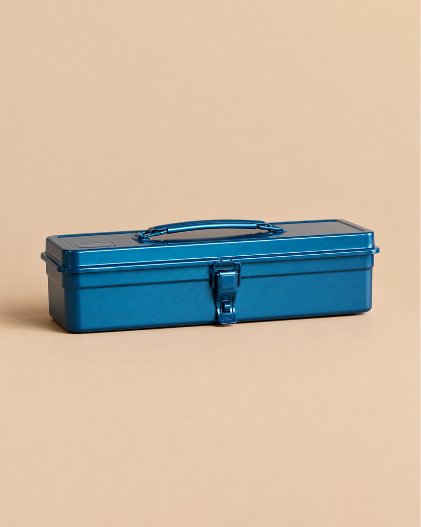 Rectangular blue Toyo - Steel Toolbox T-320 with a top handle and a central latch.