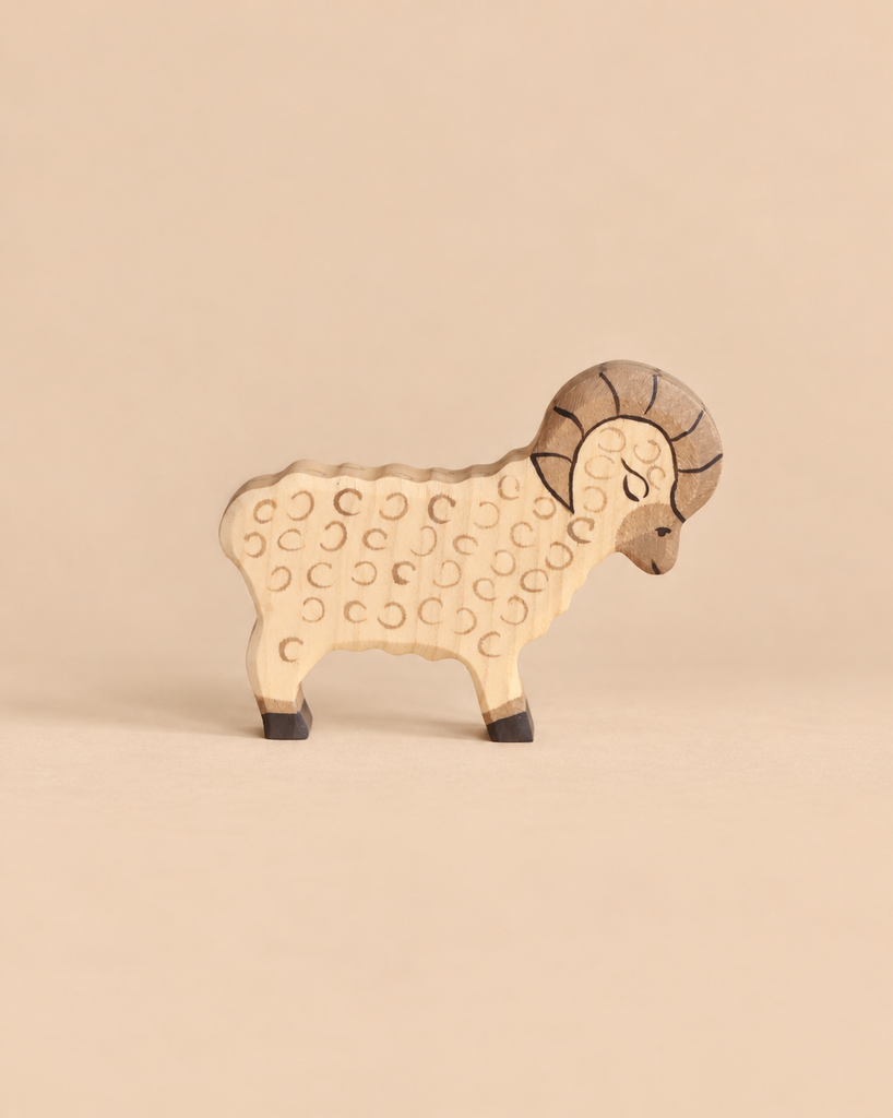 Holztiger Ram handcrafted wooden toy with a carved curled horn and stamped circular details representing fleece.