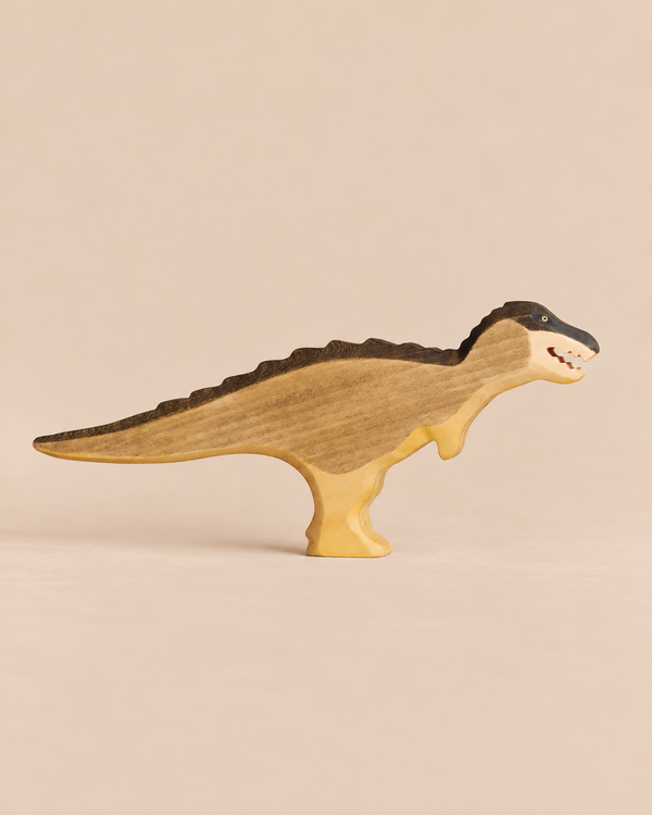 Handmade Holzwald Dinosaur - T-Rex Green, a sustainable wooden toy with a dark brown back and head and a light tan body.
