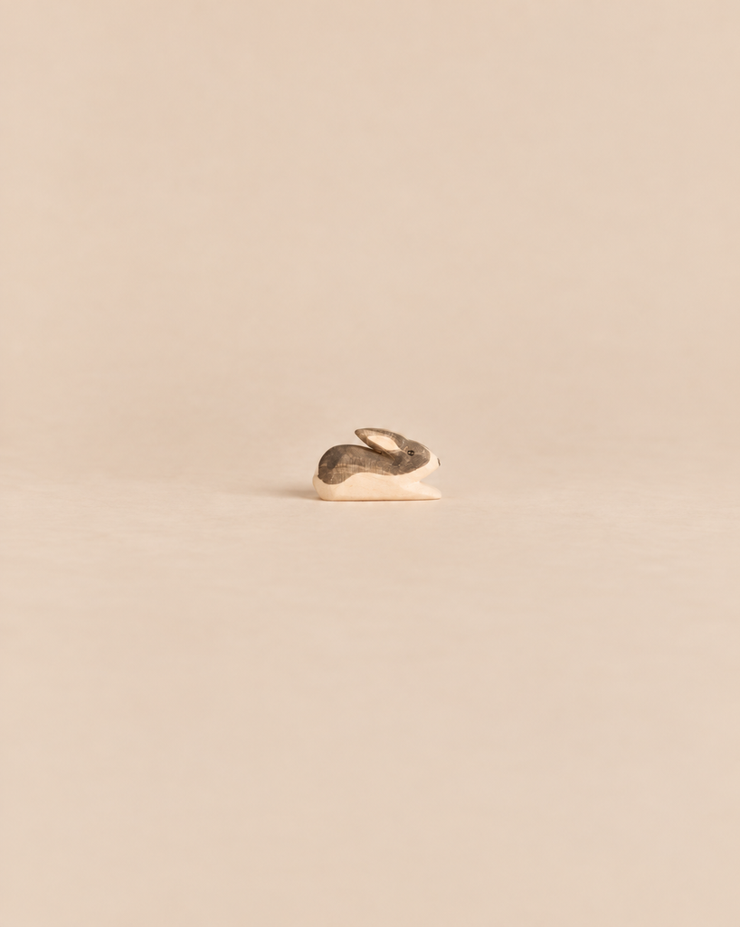 Handcrafted Ostheimer Black & White Rabbit - Small wooden toy with brown and cream painted markings, designed for imaginative play.