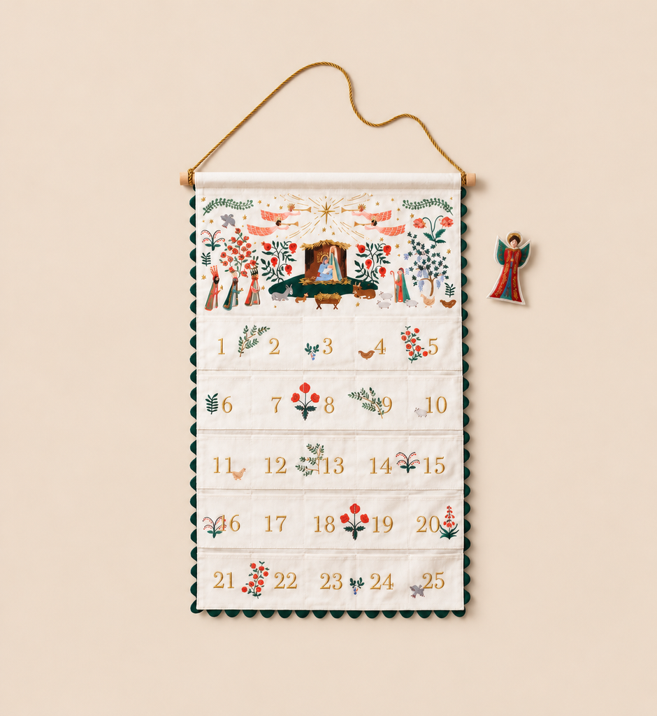 Nativity Embroidered Hanging Advent Calendar featuring a nativity scene, twenty-five numbered pockets with botanical illustrations, and a separate angel ornament.