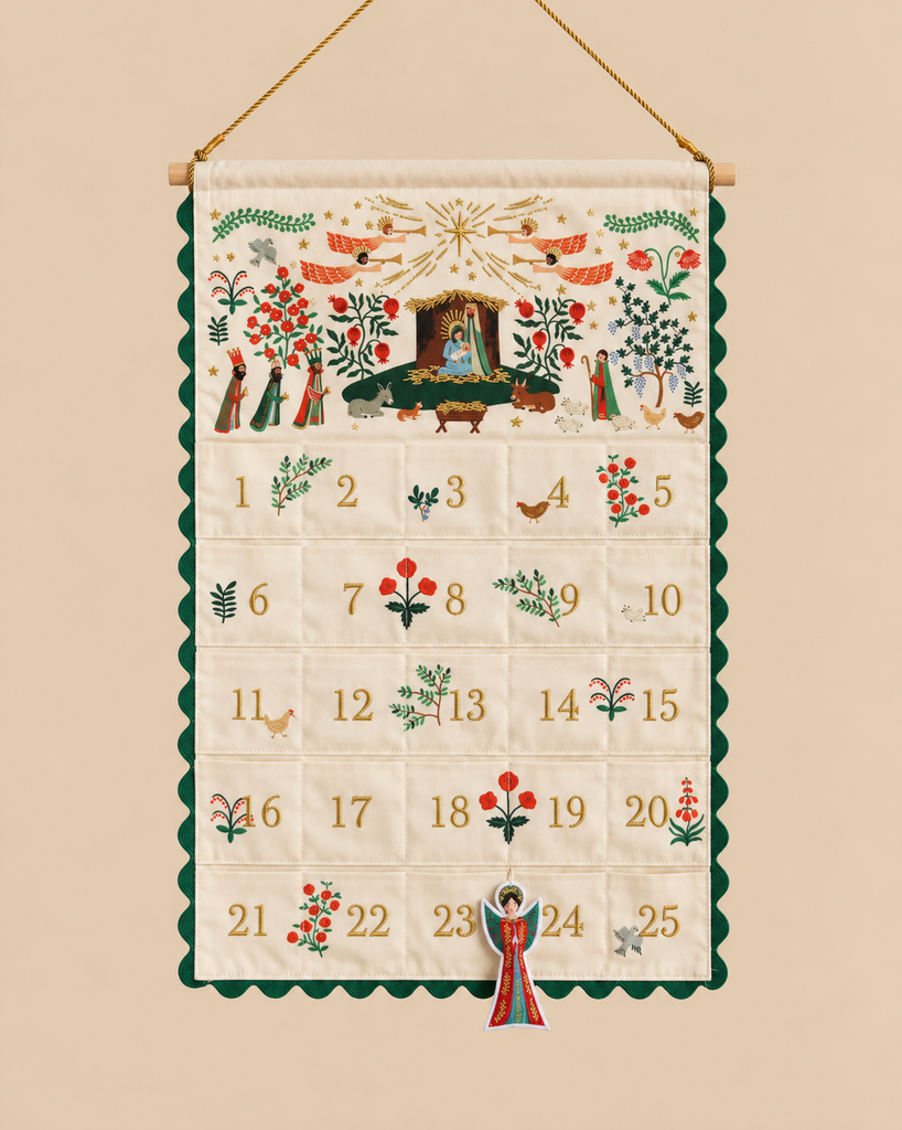 Nativity Embroidered Hanging Advent Calendar with numbered pockets from 1 to 25, decorated with embroidered scenes, angels, and botanical motifs, featuring a hanging angel ornament on a string.