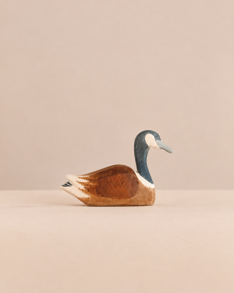 An Ostheimer Canada Goose - Swimming handcrafted wooden toy.