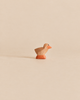 Handcrafted Ostheimer Chick, Brown figurine with an orange beak and feet.