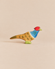 Ostheimer Pheasant handcrafted wooden figurine with a red head, blue chest, and patterned brown body.