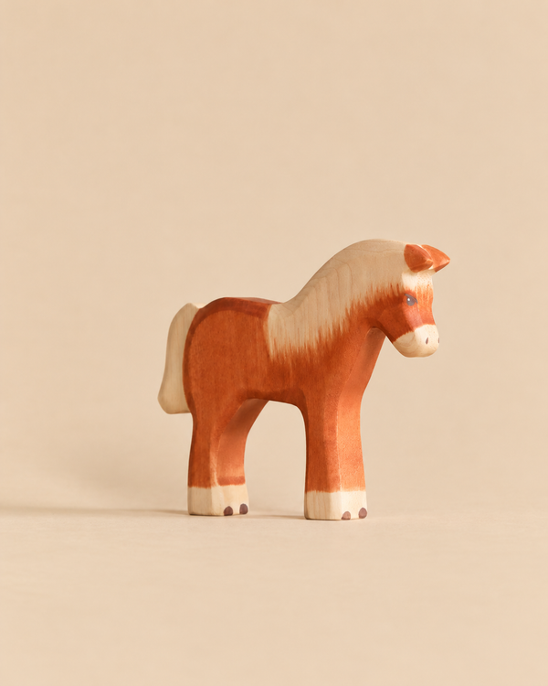 Handmade Holzwald Horse - Light Brown, a sustainable wooden toy horse with a white mane and tail designed for imaginative play.