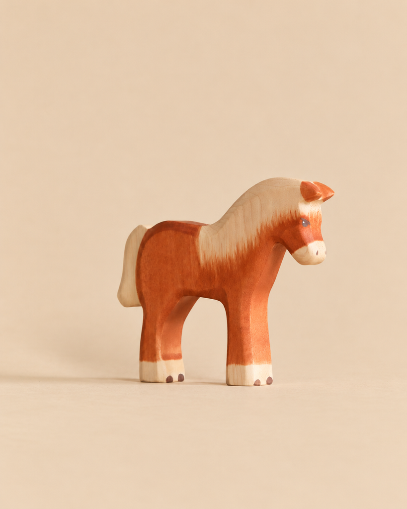 Handmade Holzwald Horse - Light Brown, a sustainable wooden toy horse with a white mane and tail designed for imaginative play.