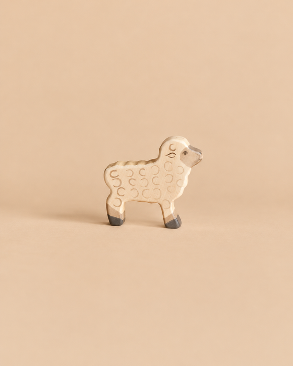Holztiger Lamb handcrafted wooden toy with painted wool texture and dark hooves.