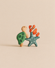 A small wooden turtle, a blue starfish, and an orange clownfish stacked together as Handmade Holzwald Ocean Animals Set sustainable toys.