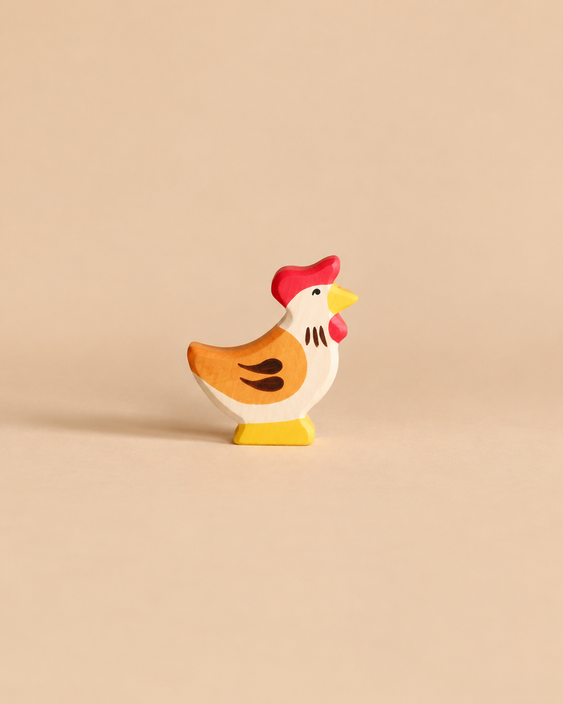 Holztiger Hen, Standing, a handcrafted wooden toy figurine with a red comb and yellow beak.