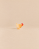 Ostheimer Hen Standing - Ochre, a handcrafted wooden hen figurine with yellow and ochre plumage and a red comb.