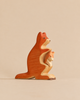 A Handmade Holzwald Kangaroo With Baby, featuring a carved wooden kangaroo with a baby joey in its pouch.