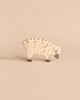 Holztiger Sheep, Eating, a handcrafted wooden toy with a carved wool texture and lowered head.