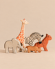 Ostheimer Handmade Wooden Safari Animals Set featuring five handcrafted wooden figurines—an elephant, giraffe, zebra, lion, and tiger—perfect for imaginative play.