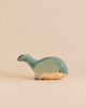 Handmade Holzwald Whale figurine, stylized and crafted from wood in shades of blue and natural wood.