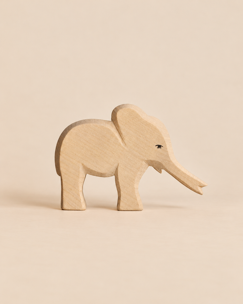 Handcrafted Ostheimer Small Elephant - Trunk Out with its trunk extended, perfect for imaginative play.