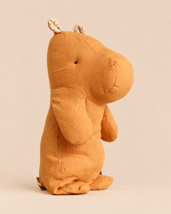 A vintage yellow Maileg Safari Friends, Hippo, Medium plush toy standing in profile.