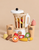 Fruit & Smoothie Blender Set featuring a toy blender, two cups, a knife, and sliced wooden play food including orange, strawberry, kiwi, and banana.