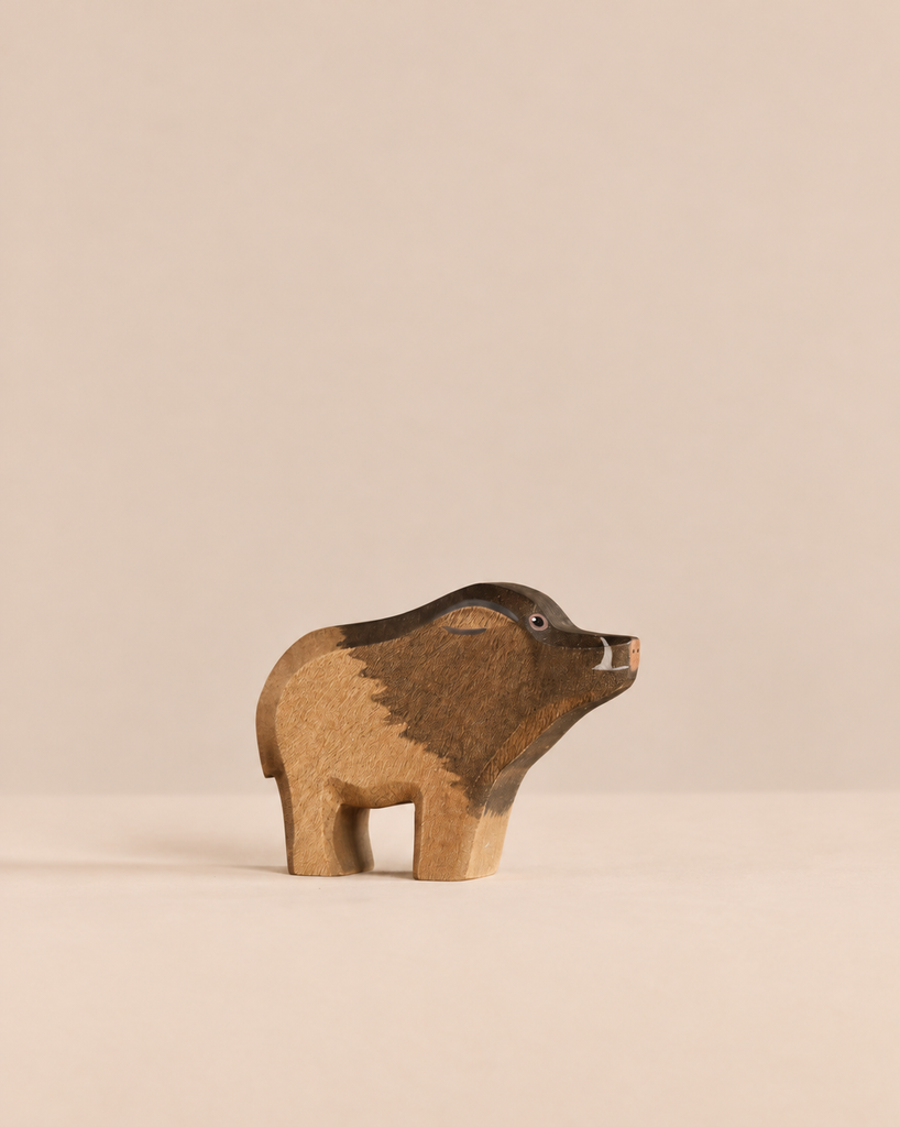 Handmade Holzwald Wild Boar figurine with dark brown and light tan markings.
