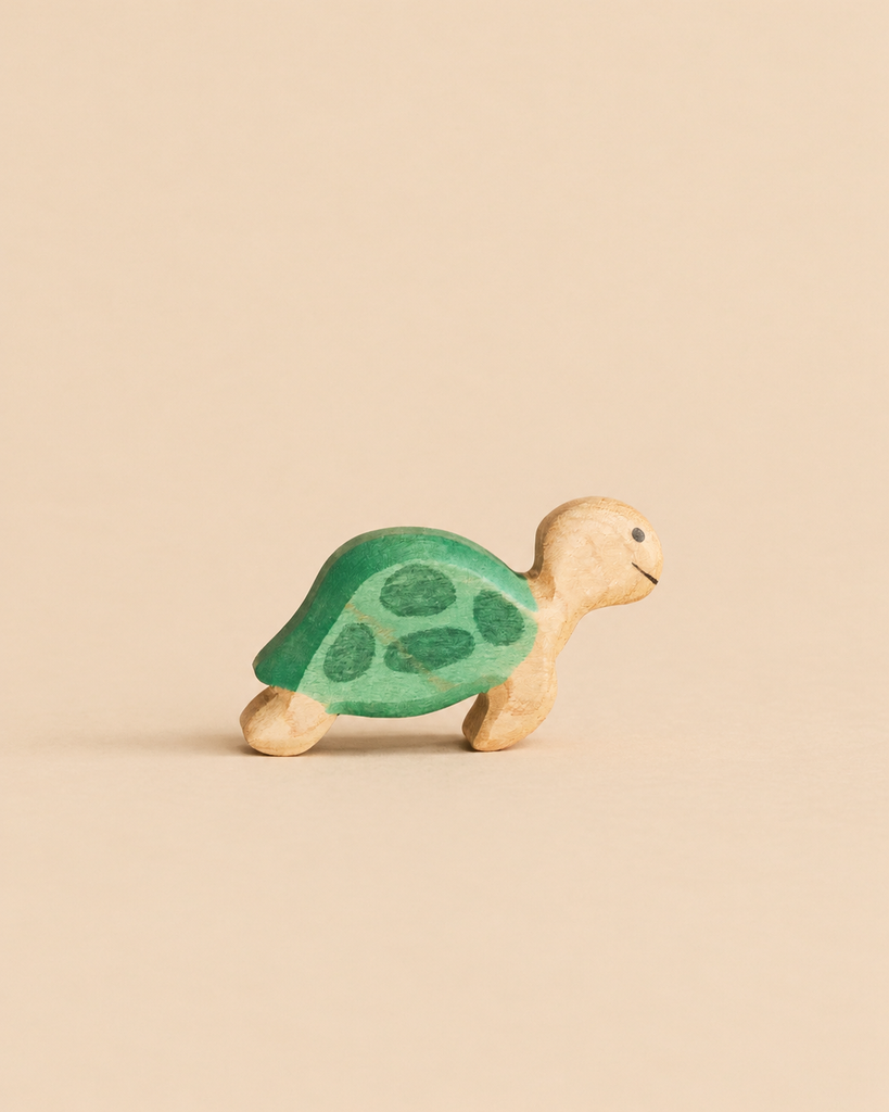 Handmade Holzwald Sea Turtle figurine with a green shell painted with darker spots.