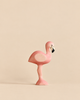 A Handmade Holzwald Bird - Flamingo figurine in shades of pink with a black and white beak.
