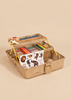 Gold glitter-covered tiered Konges Sloejd Creative Art Caddy - Tiger filled with a kids art supplies coloring set, including pens, a pair of scissors, and a sheet of animal stickers.