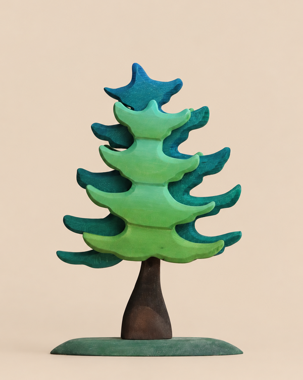 Bumbu Handmade Wooden Extra Large Green Spruce Tree featuring tiered branches in shades of blue and green with a dark brown trunk on an oval base for imaginative woodland play.