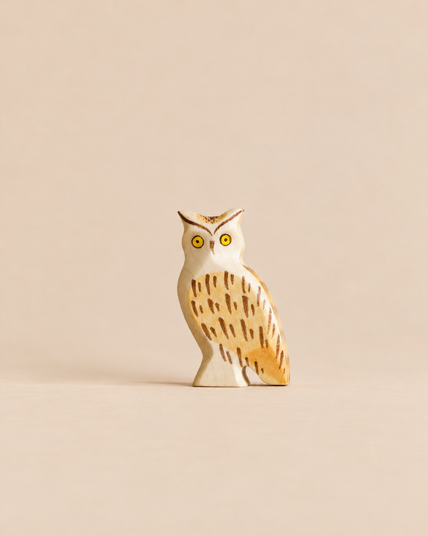 Handmade Holzwald Bird - Owl figurine featuring painted yellow eyes and brown feather markings.