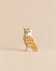 Handmade Holzwald Bird - Owl figurine featuring painted yellow eyes and brown feather markings.