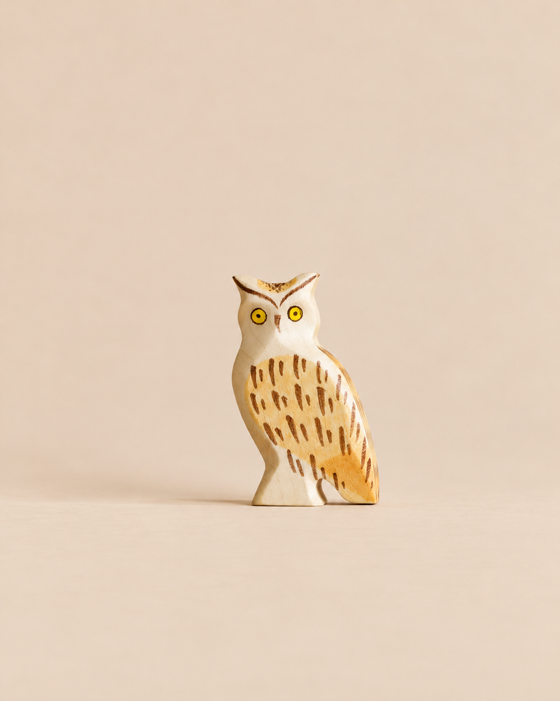 Handmade Holzwald Bird - Owl figurine featuring painted yellow eyes and brown feather markings.