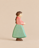 Handmade Holzwald Goose Girl figurine, hand-carved from wood as a girl in a pink top and green skirt for imaginative play.