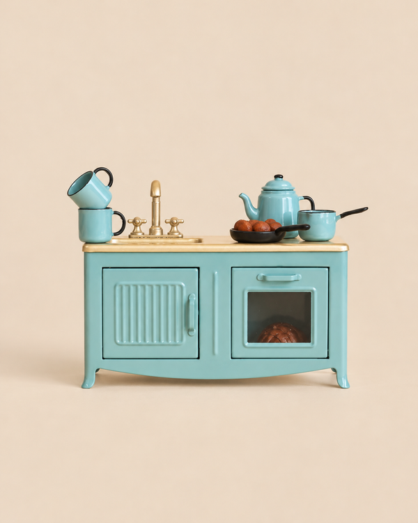 Maileg Blue Kitchen Set featuring a sink, faucet, teapot, saucepan, two stacked mugs, and a pan of food for a mouse.