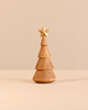 Spring Copenhagen The Christmas Tree, Oak, a minimalist wooden sculpture with tiered branches and a small gold star on top.