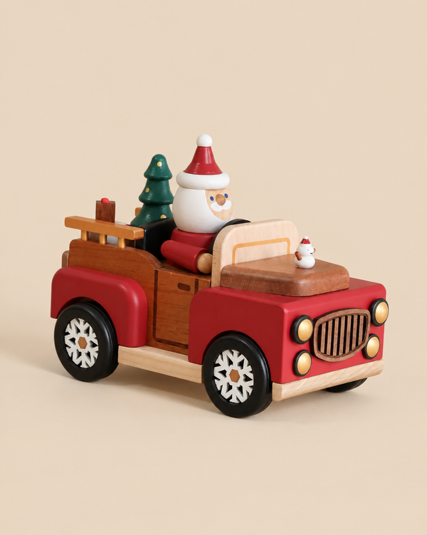 A Santa-mobile Music Box featuring a premium hardwood toy truck carrying a Santa Claus figurine and a small Christmas tree, with a tiny snowman on the hood.