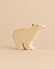 Hand-carved Holztiger Polar Bear figurine featuring simple painted eyes and claw details on a handcrafted wooden animal figure.