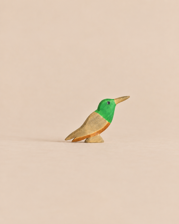 Handmade Holzwald Bird - Hummingbird figurine with a green head and natural wood-toned body.