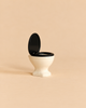 Maileg Small Toilet, Mouse Size - Off White miniature dollhouse bathroom toilet with a black seat and raised lid.