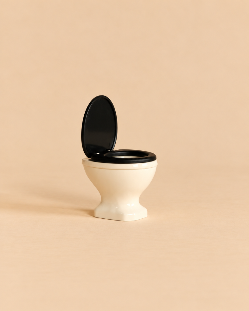 Maileg Small Toilet, Mouse Size - Off White miniature dollhouse bathroom toilet with a black seat and raised lid.