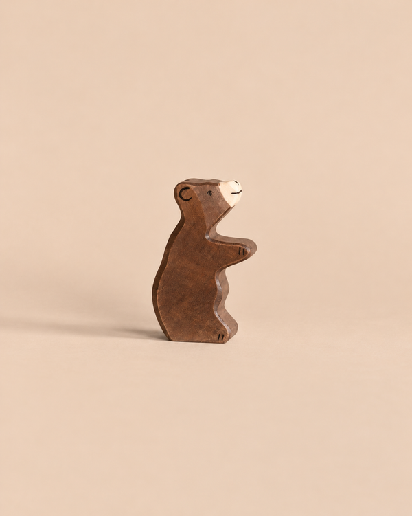 Holztiger Little Brown Bear, a handcrafted wooden figurine standing on its hind legs.