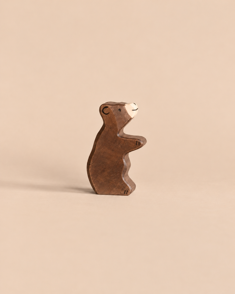 Holztiger Little Brown Bear, a handcrafted wooden figurine standing on its hind legs.