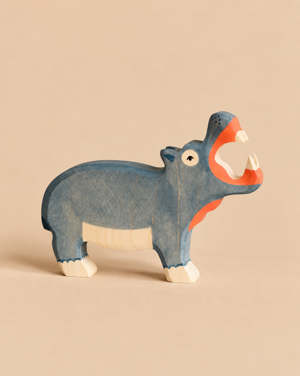 Handcrafted Holztiger Hippo - Open Mouth wooden toy painted blue with orange accents and an open mouth.