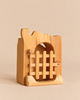 Ostheimer Jailhouse handcrafted wooden toy structure featuring an arched doorway with a movable barred gate.