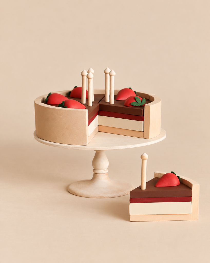 Sabo Concept Handmade Chocolate Layer Cake On A Stand featuring a wooden cake with strawberries and candles, displayed on a pedestal stand with one slice removed and placed in front.