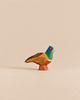 Handmade Holzwald Bird - Pheasant, a small, hand-painted wooden toy with a blue head, green neck, and brown and yellow body.
