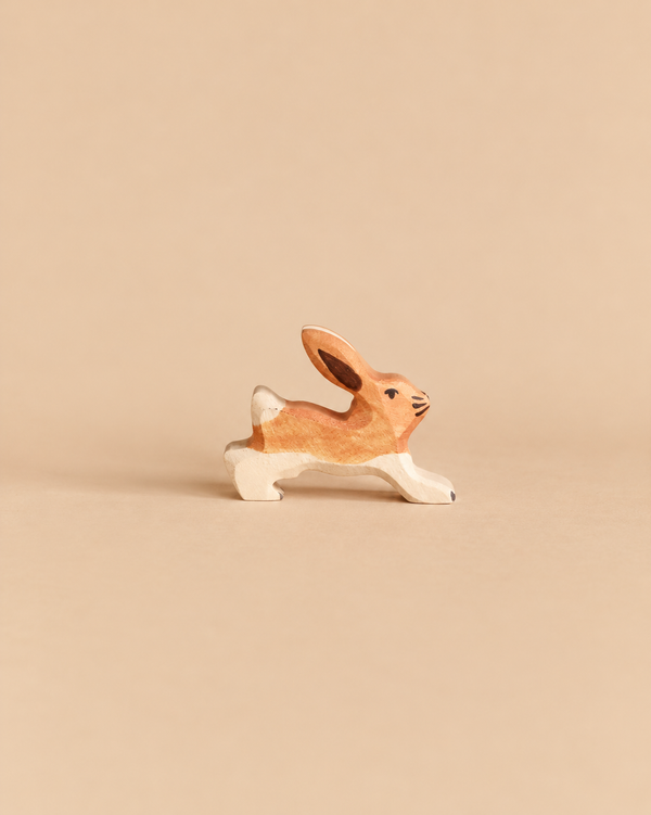 Holztiger Rabbit, Running, a handcrafted wooden toy rabbit in a running pose.