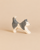 Handcrafted wooden Ostheimer Sled Dog, Running, shaped as a grey and white husky in a running pose.