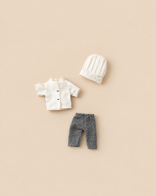 Maileg Extra Clothing: Chef Clothes For Big Sister And Big Brother Mouse, featuring a white jacket with black buttons, black and white checkered pants, and a white chef’s hat.