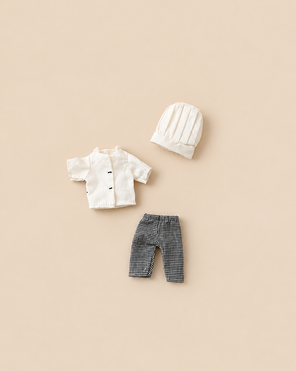 Maileg Extra Clothing: Chef Clothes For Big Sister And Big Brother Mouse, featuring a white jacket with black buttons, black and white checkered pants, and a white chef’s hat.