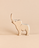 An Ostheimer Small Elephant - Trumpeting, a handcrafted wooden figurine with its trunk raised, designed for imaginative play.